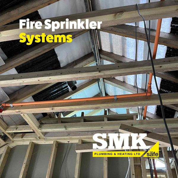 Sprinkler pipework fixed across the rafters of a new roof
